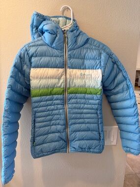 cotopaxi Light Blue Hooded Fuego Puffer Jacket. 800 fill down